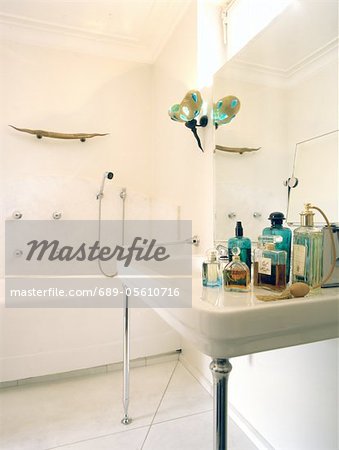 Bathroom with tub and several body care products