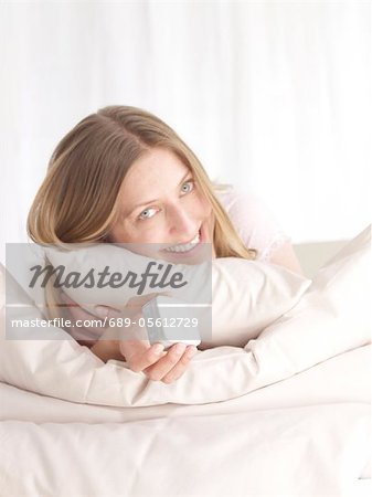 Smiling woman in bed