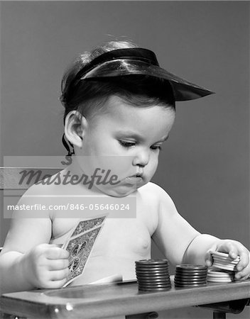 1960s BABY GIRL PLAYING WITH CARDS POKER CHIPS GAMBLER INDOOR