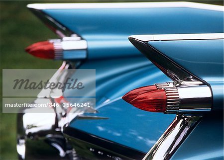 1950s - 1960s DETAIL FINS REAR TAIL LIGHTS BLUE CADILLAC AUOMOBILE