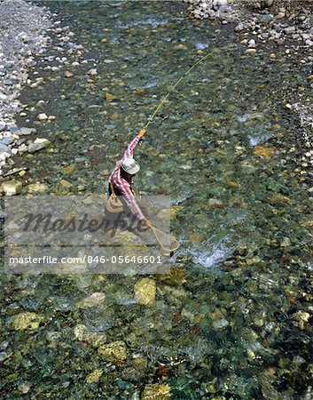 1970s TROUT FISHERMAN, SWIFT CURRENT LAKE, GLACIER PARK, MONTANA