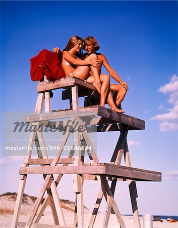 1970s TEEN COUPLE ON LIFE GUARD STAND