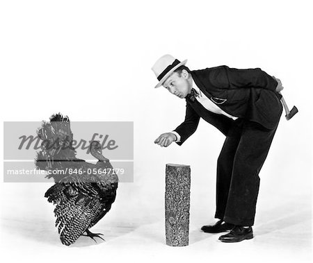 1930s - 1940s MAN CHARACTER WITH HATCHET TRYING TO CATCH A THANKSGIVING TURKEY