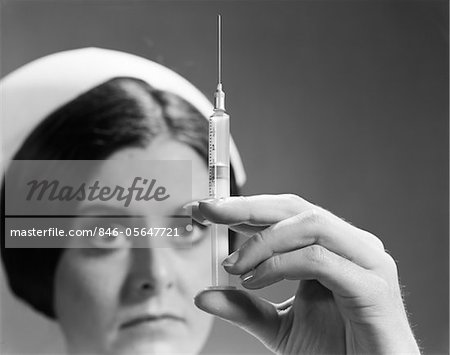 1960s NURSE ADJUSTING DOSAGE INJECTION HYPODERMIC NEEDLE