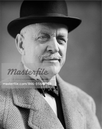 1930s PORTRAIT OF OLDER MAN WITH A MUSTACHE WEARING A BOWLER HAT AND BOW TIE