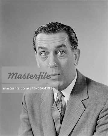 1960s BUSINESSMAN BULGING EYES WIDE OPEN SHOCKED FACIAL EXPRESSION