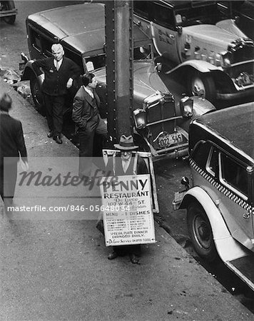 1930s NYC STREET DURING DEPRESSION WITH MAN WEARING SANDWICH BOARD ADVERTISING PENNY RESTAURANT