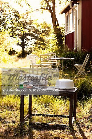Utensils on table outside cottage