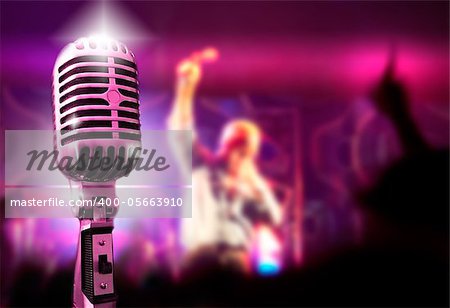 Music background with vintage microphone and concert