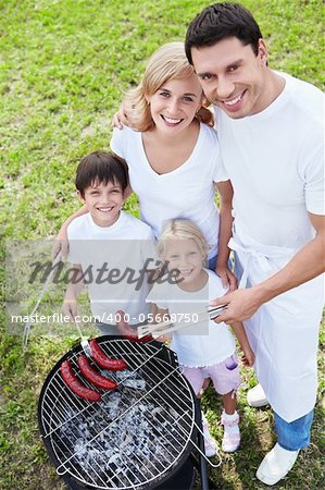 Family at barbecue outdoors