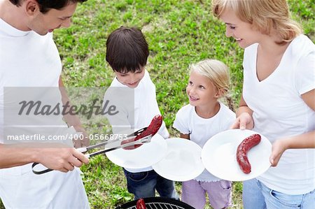 Father gives food to children