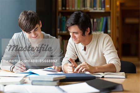 Students preparing an essay in the library