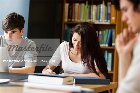 Students working on an essay in the library