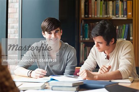 Young men studying in a library