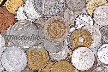 Coins currency from multiple countries, taken from top in isolated background view can be use for financial purposes