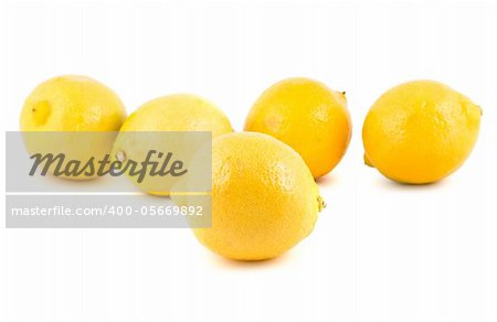 Yellow ripe lemons isolated on white background