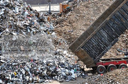 Truck unloading metal waste for recycling