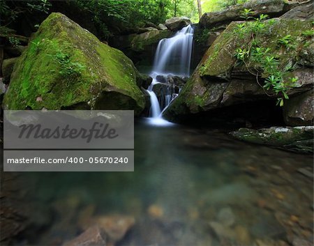 waterfall with two boulders in smokey mountains