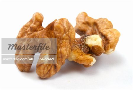 Crushed walnuts on white background