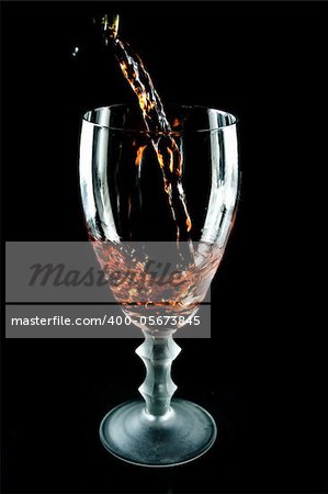 Glass of wine on  black background