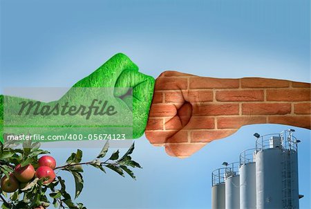 Two hands against each other. Green hand with grass and brick wall hand. Confrontation environment against construction industry. Apple tree with apples