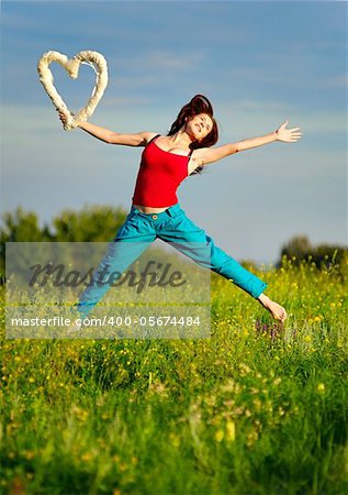 Sport woman running on a sunset field