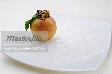 Foie gras with apple served on white plate