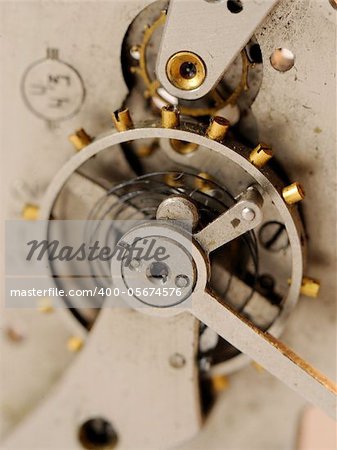 close up view of gears from old clock mechanism
