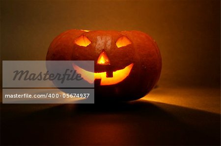 lantern, illuminating pumpkin in dark night