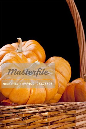 Small orange pumpkins symbolizing autumn holidays and used in decorative works.
