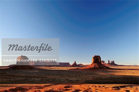 Mittens and Buttes in Monument Valley Navajo Tribal Park Arizona from Artist Point during sunset
