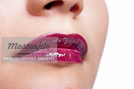 Girl's lips with dark red lipstick closeup