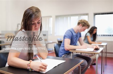 Serious young adults studying in a classroom