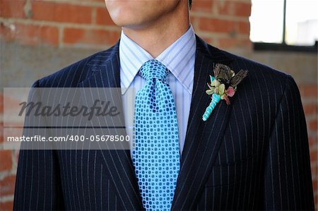 Image of a Blue Pinstriped Suit with Tie and Boutonniere