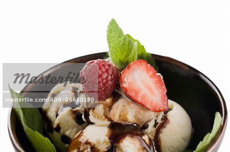 Dessert. Ice cream watered chocolate  with strawberries and mint leaves