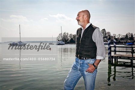 An old man relaxing at the lake Starnberg