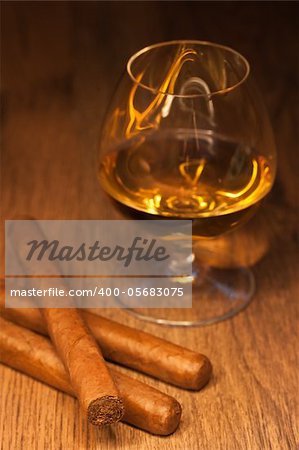 typical havana cigars with pure whisky drink background