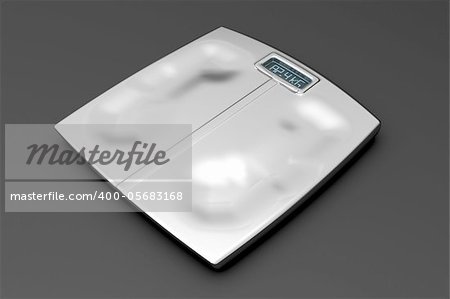 Metal weight scale with footprints on gray background