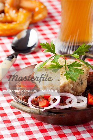 goulash with dumpling on red plaid