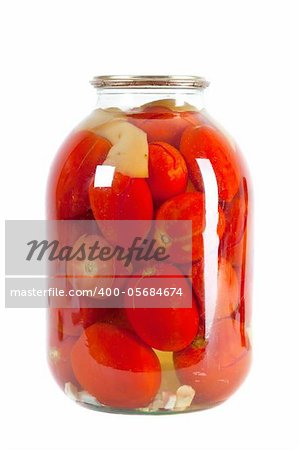 Preserved red tomatoes in a glass jar isolated on white background