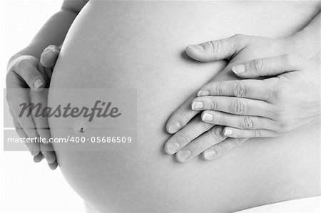 Couple Holding Pregnant Woman's Stomach