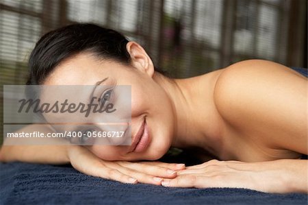 Young Woman Relaxing On Massage Table