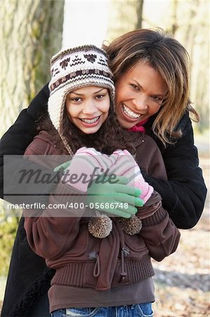 Mother And Daughter On Autumn Walk