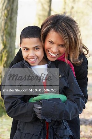 Mother And Son On Autumn Walk