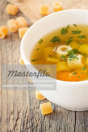 Vegetable soup with pasta and garnish