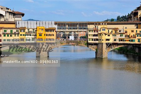 Vecchio Bridge's backside, Florence , Italy, with rower passing by