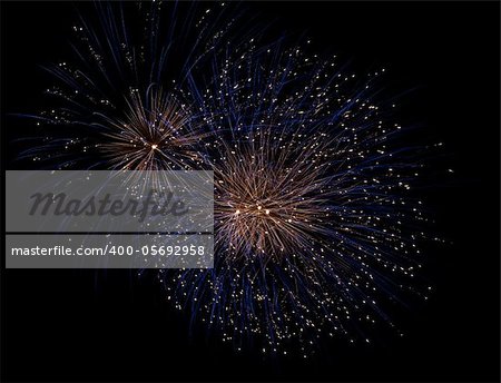 Firework display against black sky