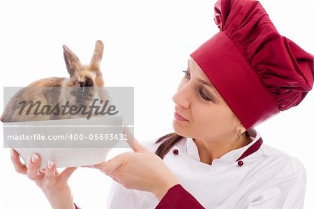 photo of succesfull female restaurant chef with rabbit inside a bowl