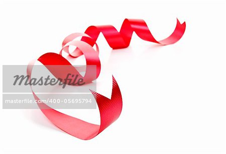 Curled red holiday ribbon strip isolated on white background