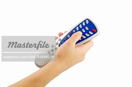 Woman's hand holds the remote isolated on a white background